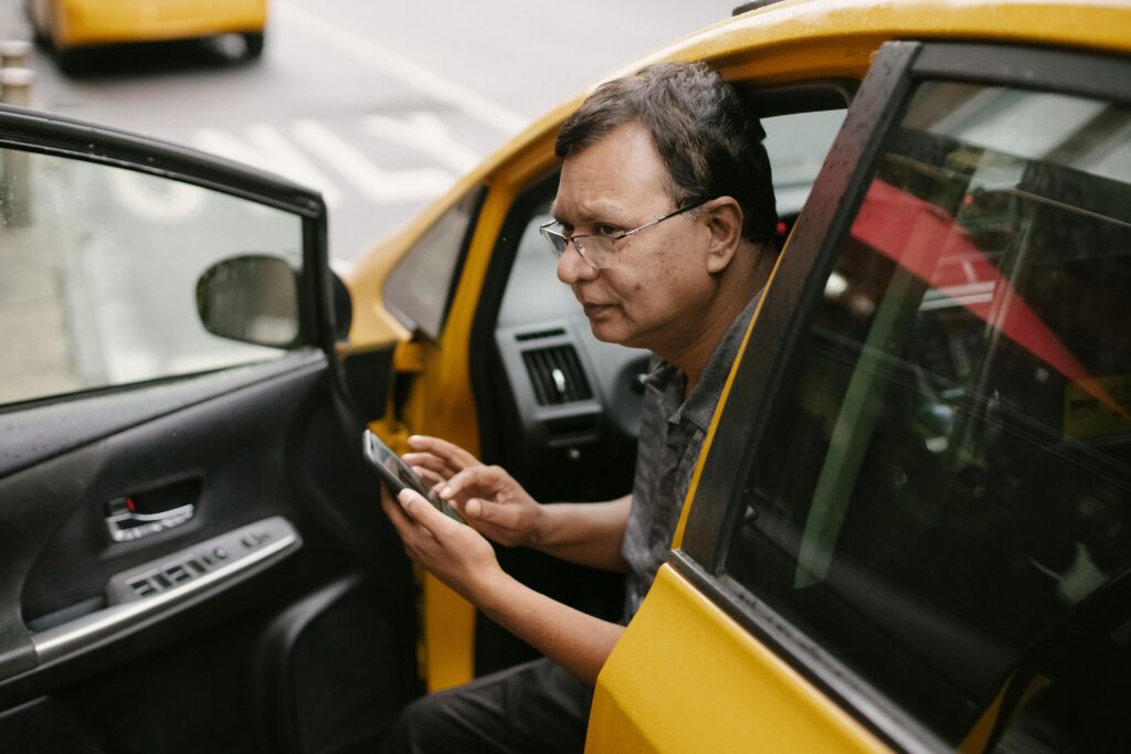 Driver checking ride-hailing earnings dashboard in UAE limousine fleet operations