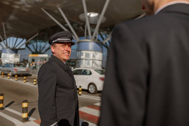 Chauffeur waiting for passengers at Dubai airport illustrating driver waiting charges Dubai